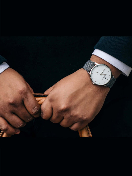 Trophy Watch Company | 40mm STERLING PERLON: The Sterling combines a silver-white dial and black and grey woven perlon strap for a look that’s crisp, neutral, and refined. Its polished 40mm stainless steel case keeps a slim profile, making it effortlessly